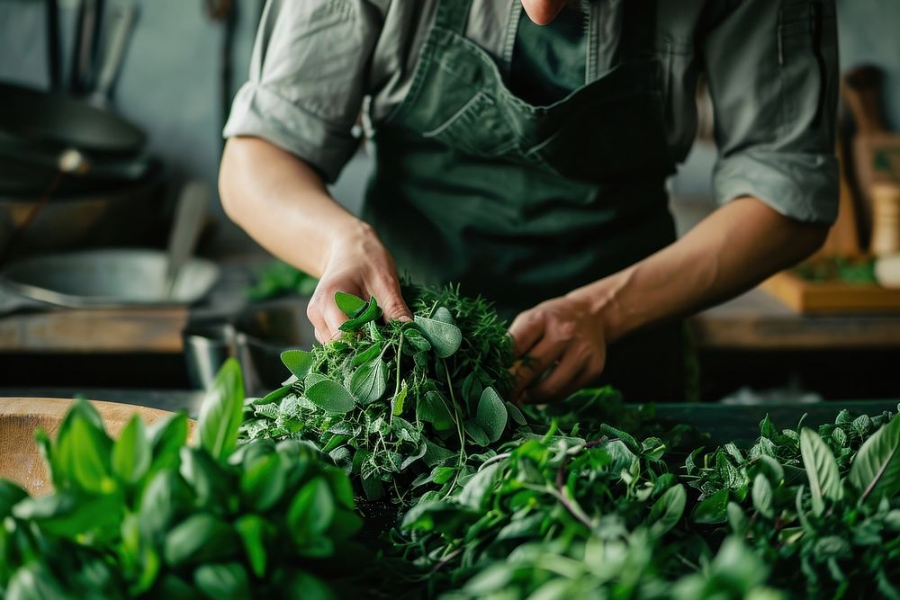 Pulling herbs plant vegetable food. Premium Photo rawpixel