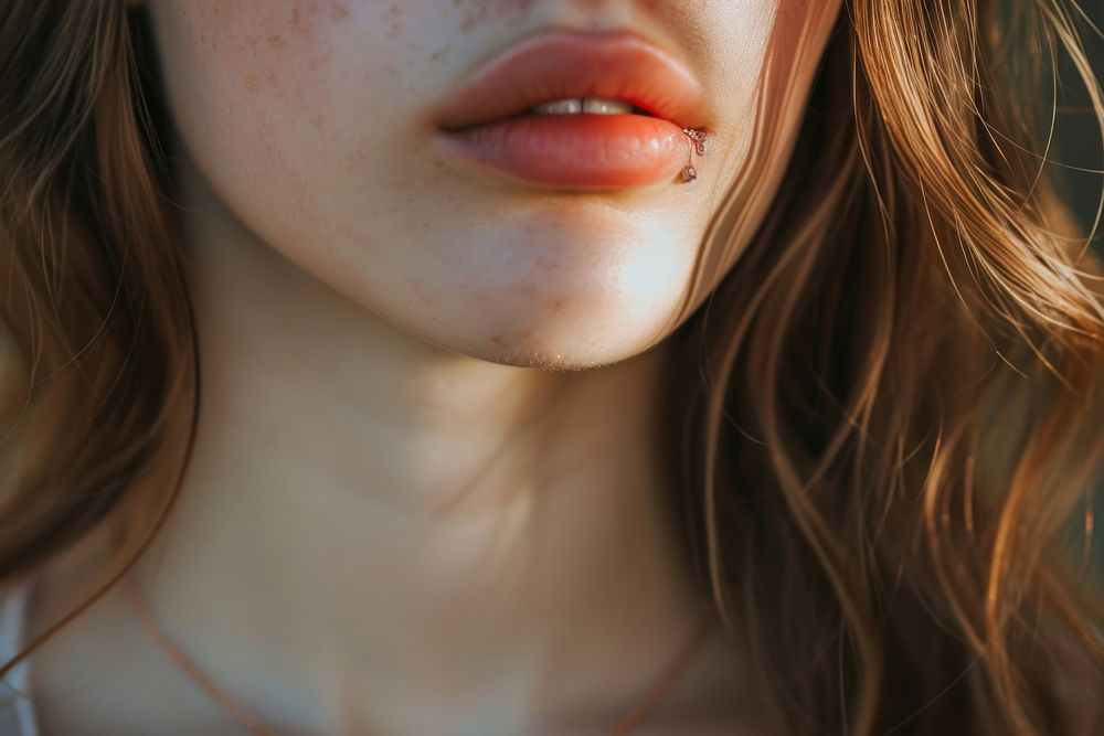 Woman wearing cute jewellery skin hairstyle lipstick.