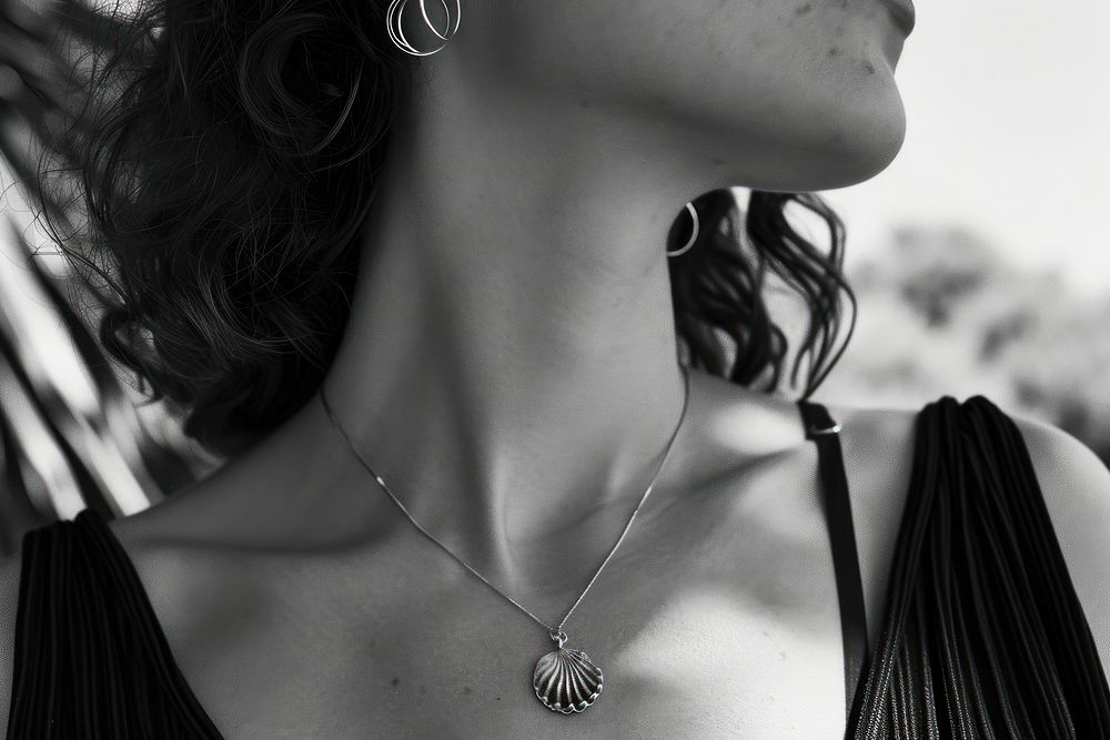 Woman wearing shell jewellery necklace jewelry pendant.
