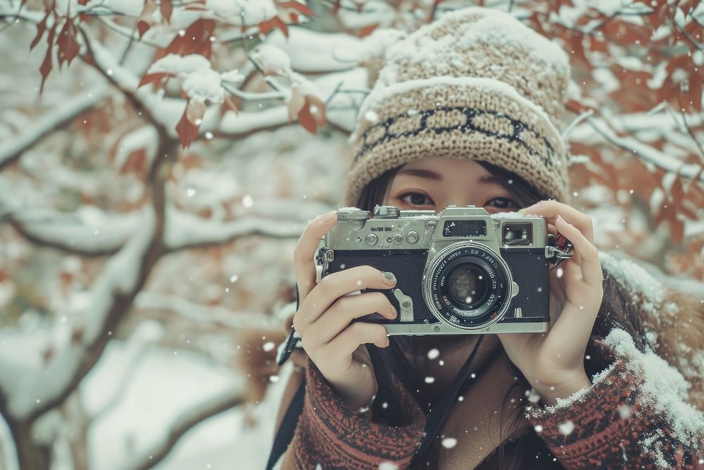 Japanese woman camera snow portrait.
