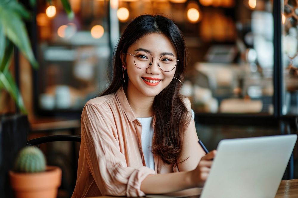 Asian entrepreneur woman laptop computer glasses.
