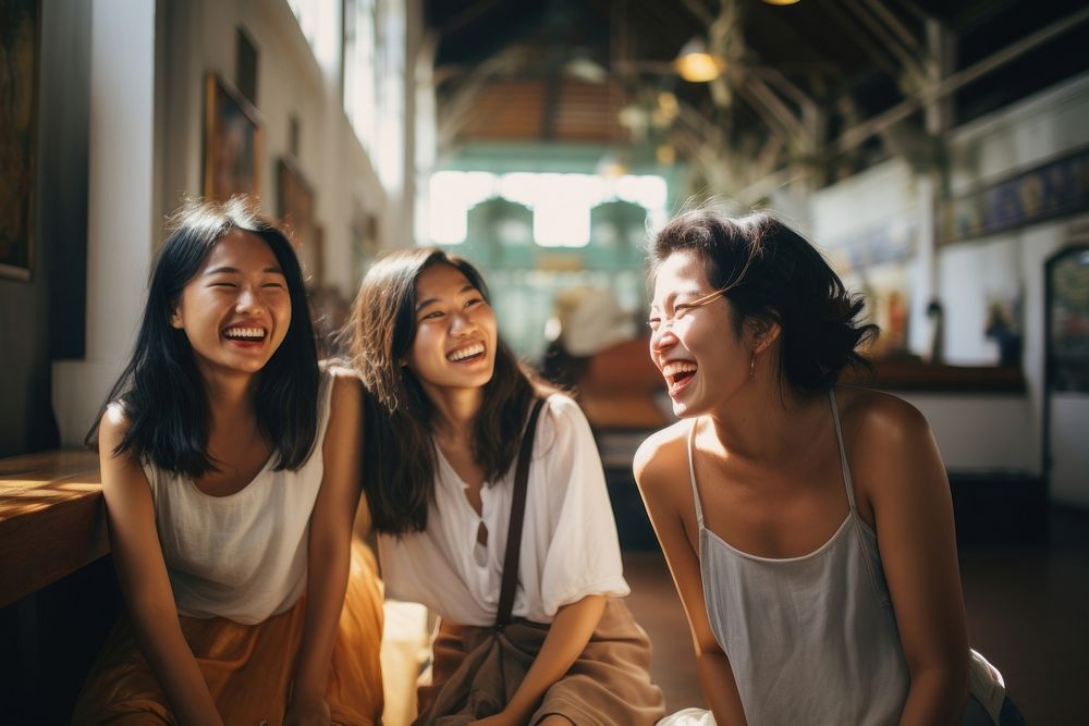  Singaporean women and friends laughing adult joy. AI generated Image by rawpixel.