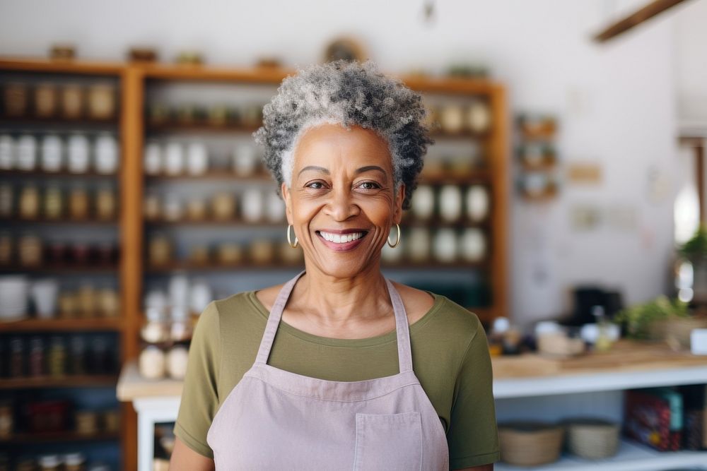 Senior black woman smiling store food.