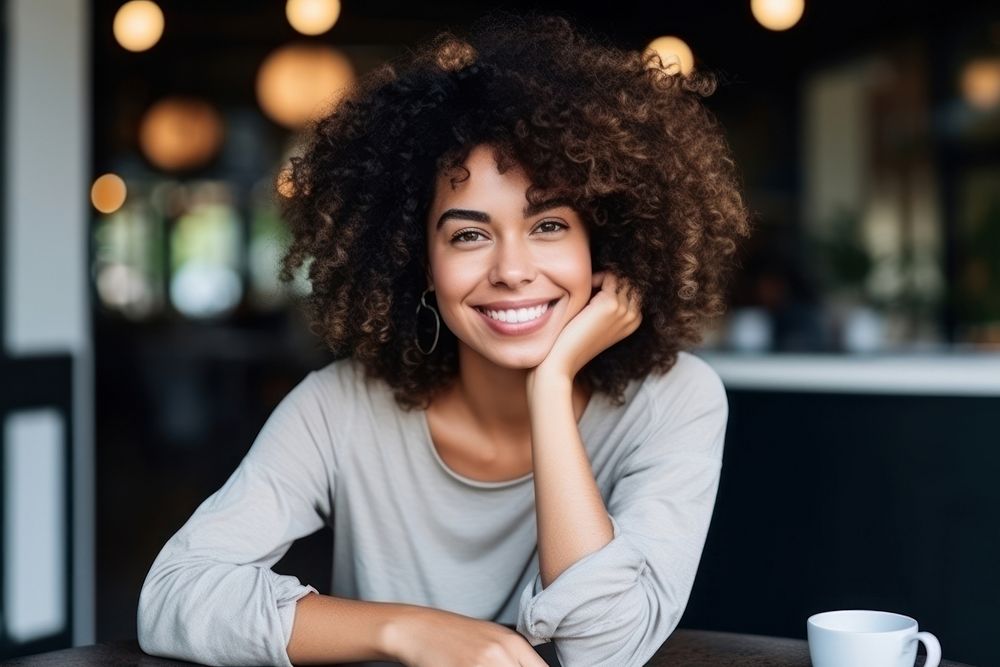 African American female smile happiness coffee.