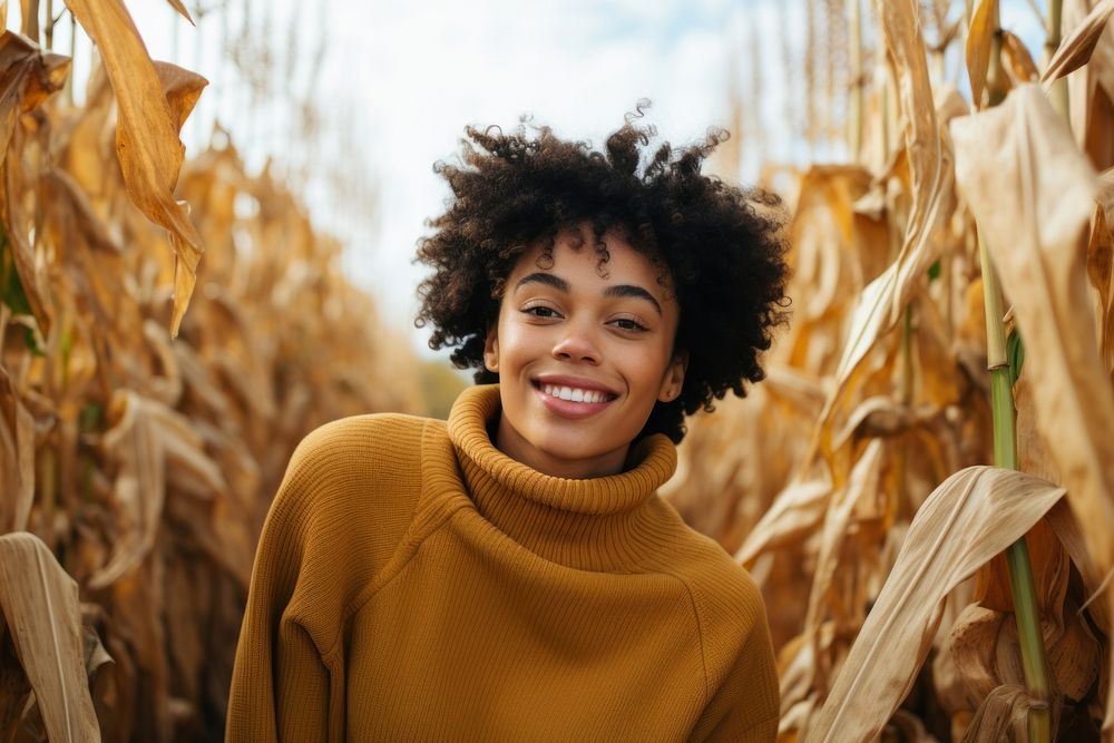 Black mixed woman smiling harvest sweater.