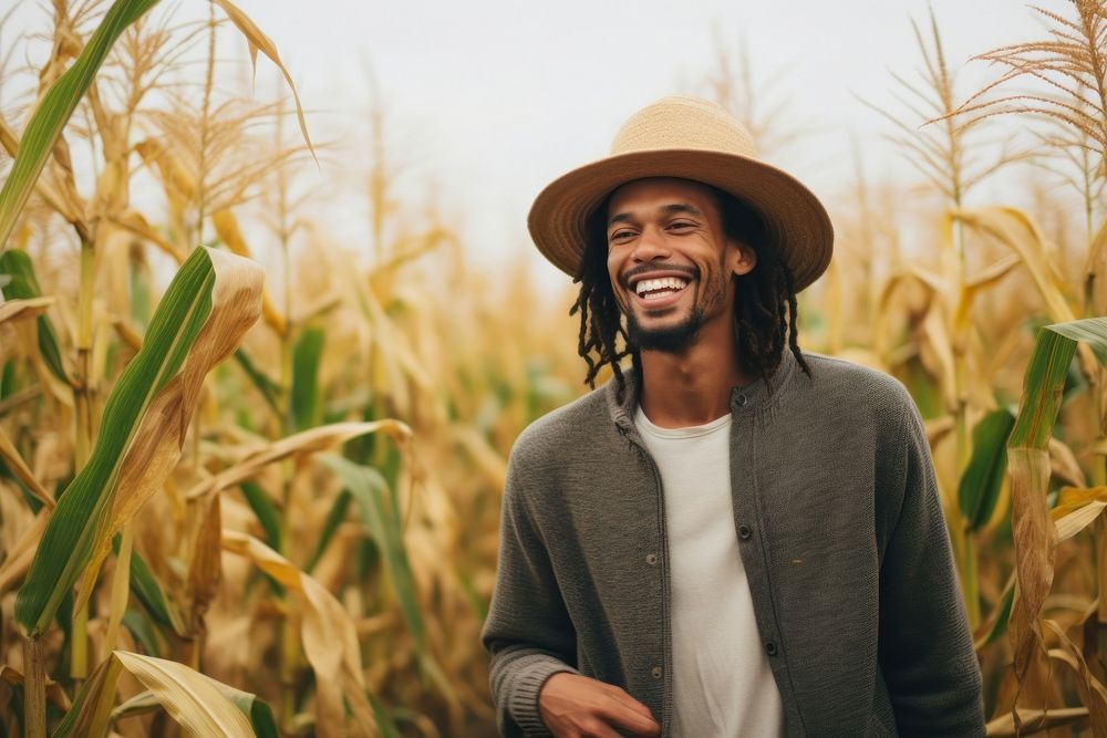Black mixed man laughing smiling field.