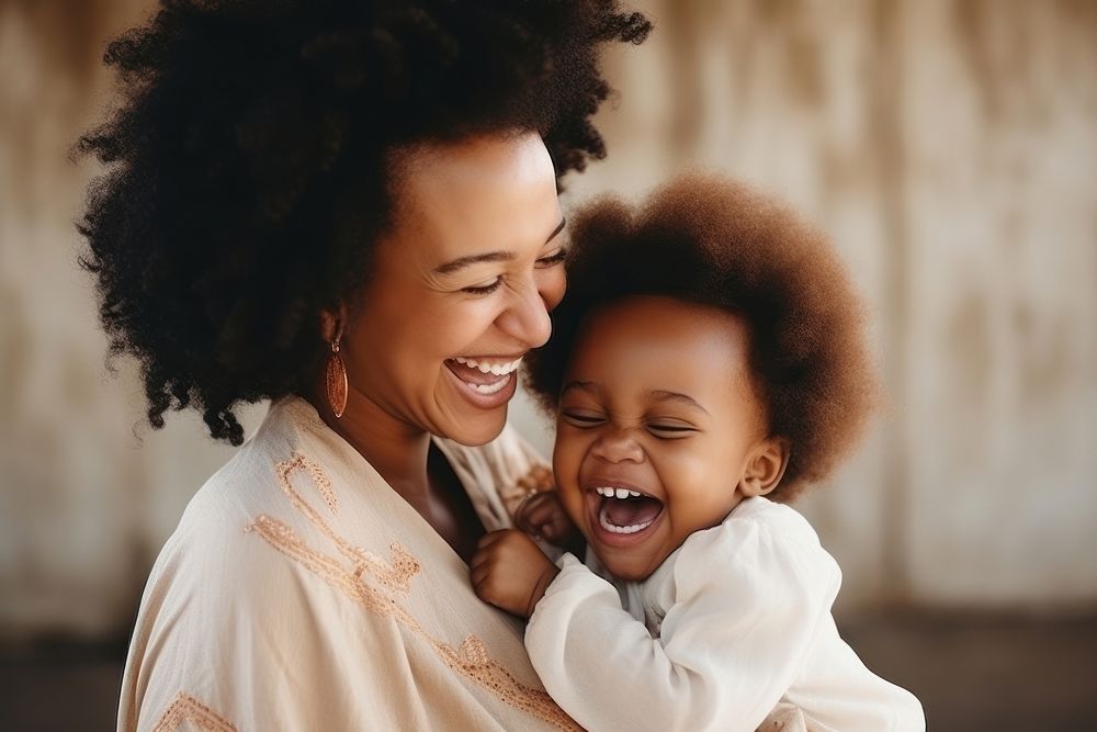 Black people laughing toddler smiling.