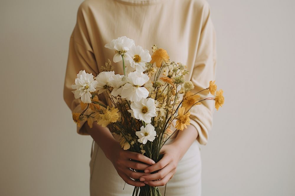 Person holding flowers plant midsection fragility.