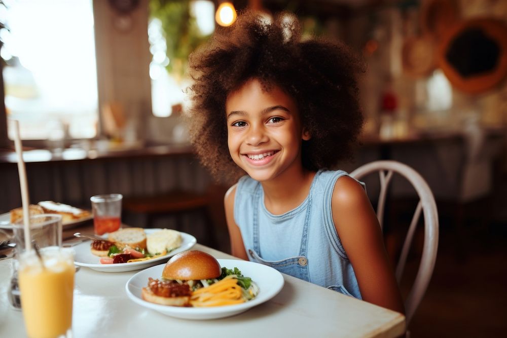 Cute African-American girl food portrait smiling.
