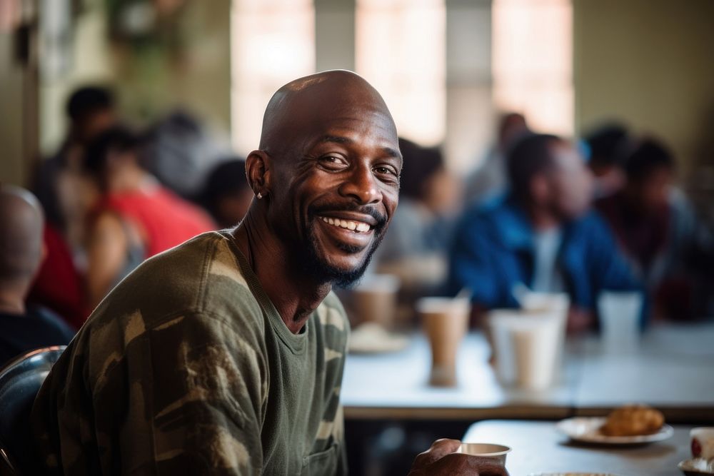 Black homeless man smiling adult smile.