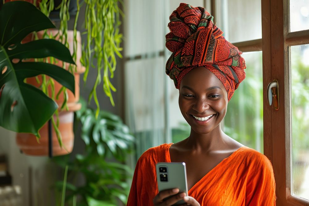 African turban using smartphone portrait smiling smile.