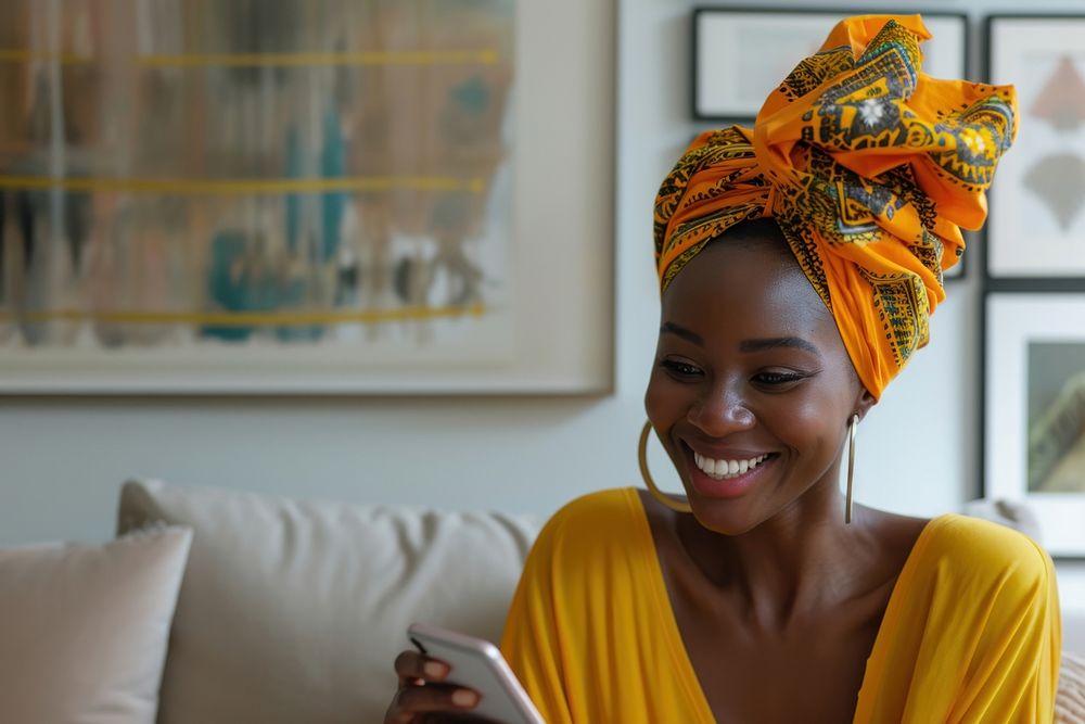 African turban using smartphone smiling smile electronics.