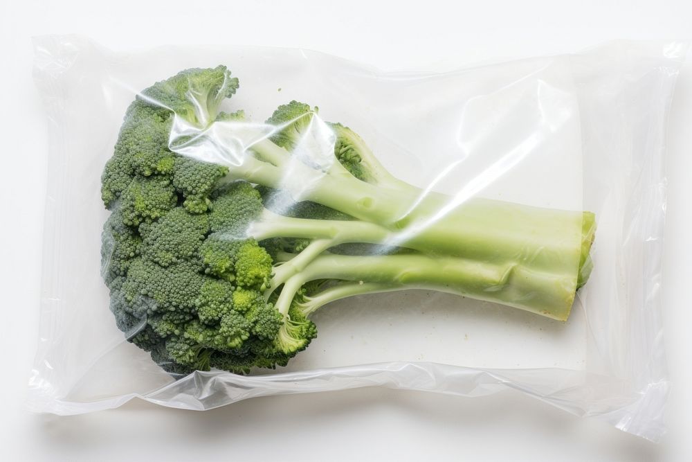 Plastic wrapping over a broccoli vegetable plant food.
