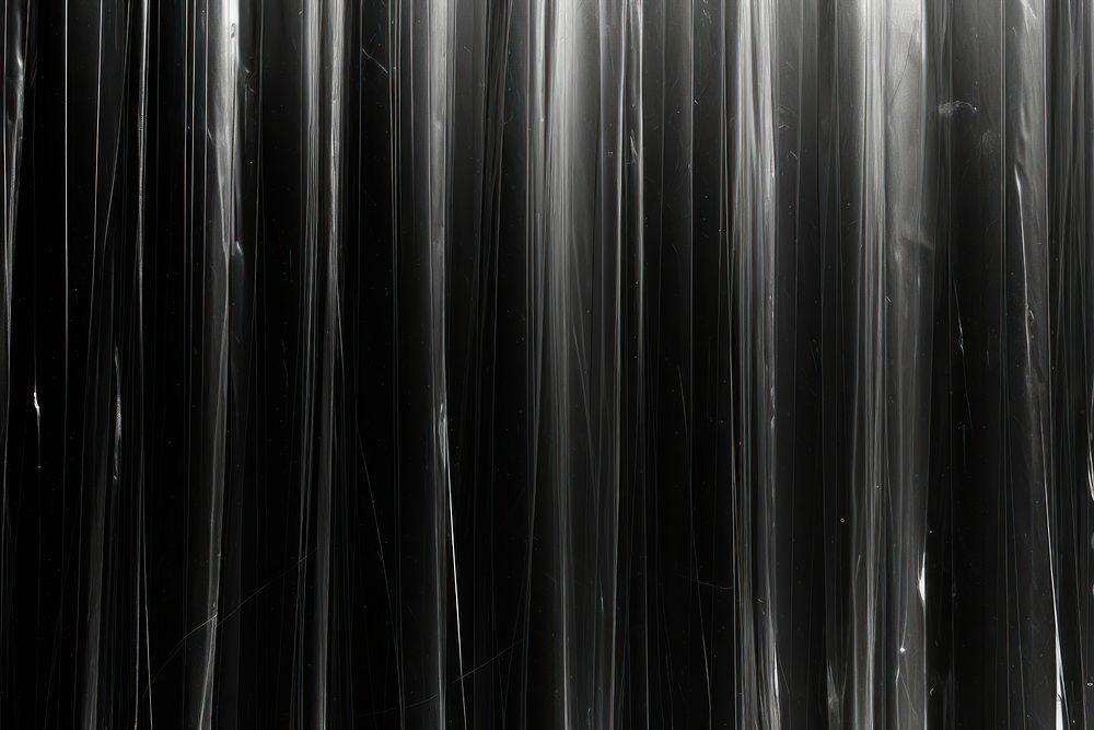 Vertical patterns plastic wrap black backgrounds texture.
