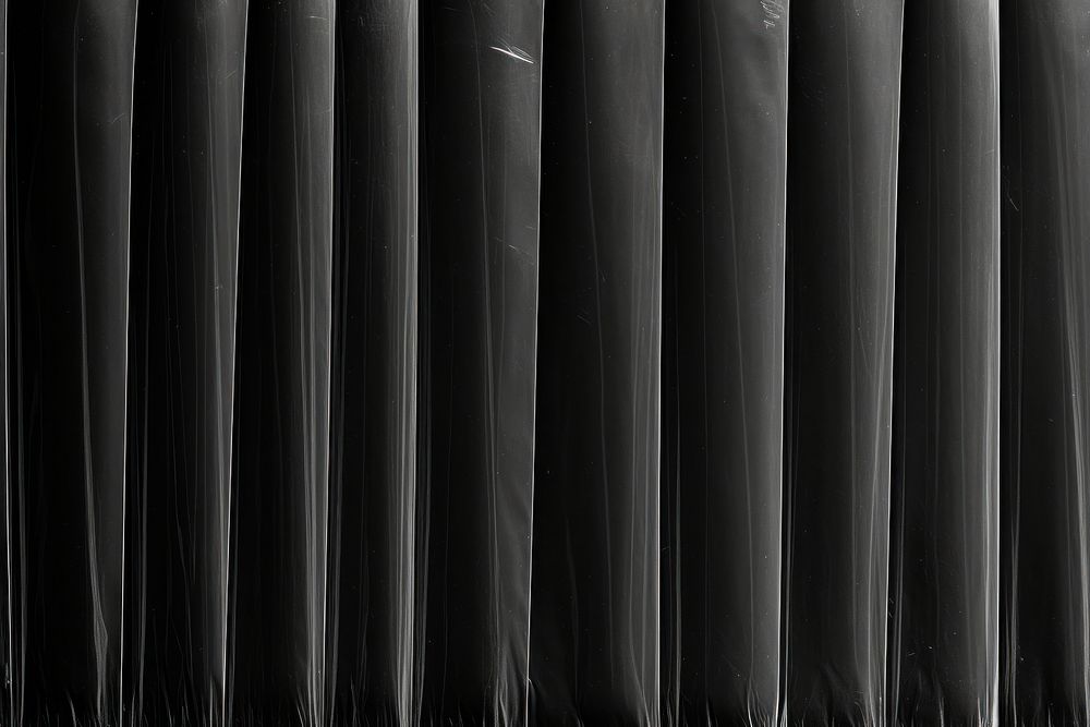 Vertical patterns plastic wrap black backgrounds repetition.