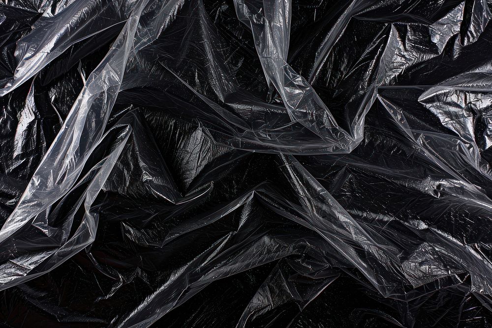 Authentic polyethylene plastic wrap backgrounds black monochrome.