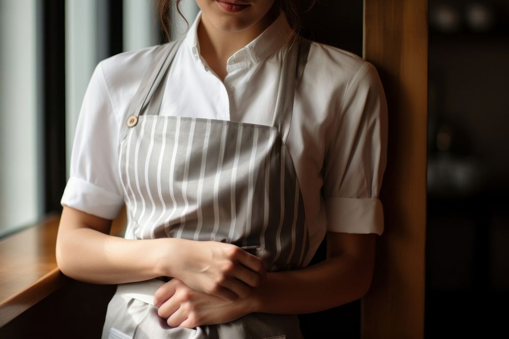 Woman wearing a white apron with a tiered waist hand midsection restaurant. AI generated Image by rawpixel.