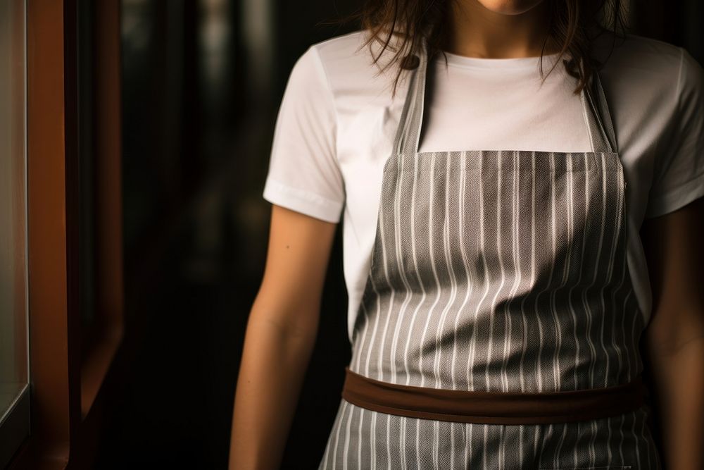 Woman wearing a white apron striped sleeve adult. AI generated Image by rawpixel.