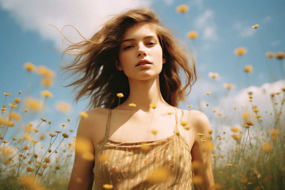 Photo of woman in flower field portrait summer plant.