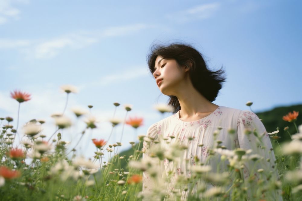Photo of woman in flower field outdoors nature summer.