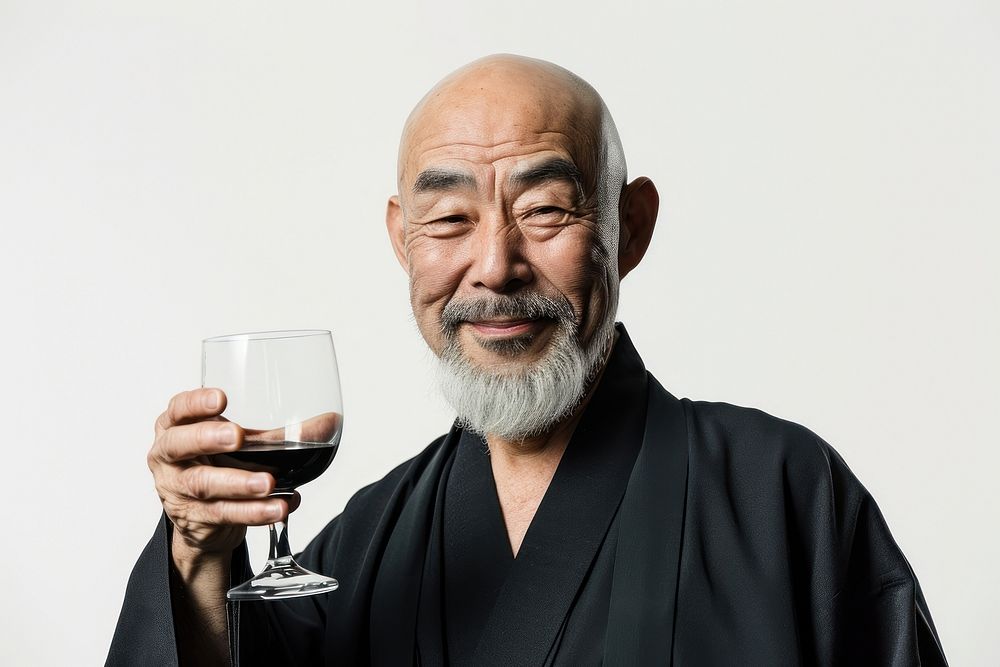 Japanese man toasting sake portrait adult photo.