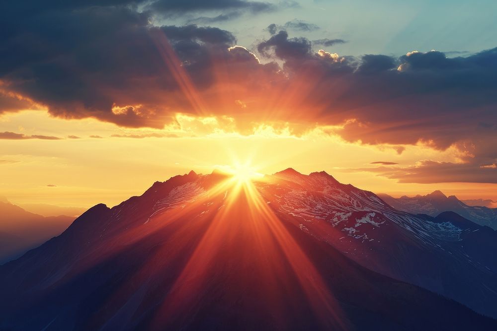 Photo of sun behind a mountain sunlight sky outdoors.