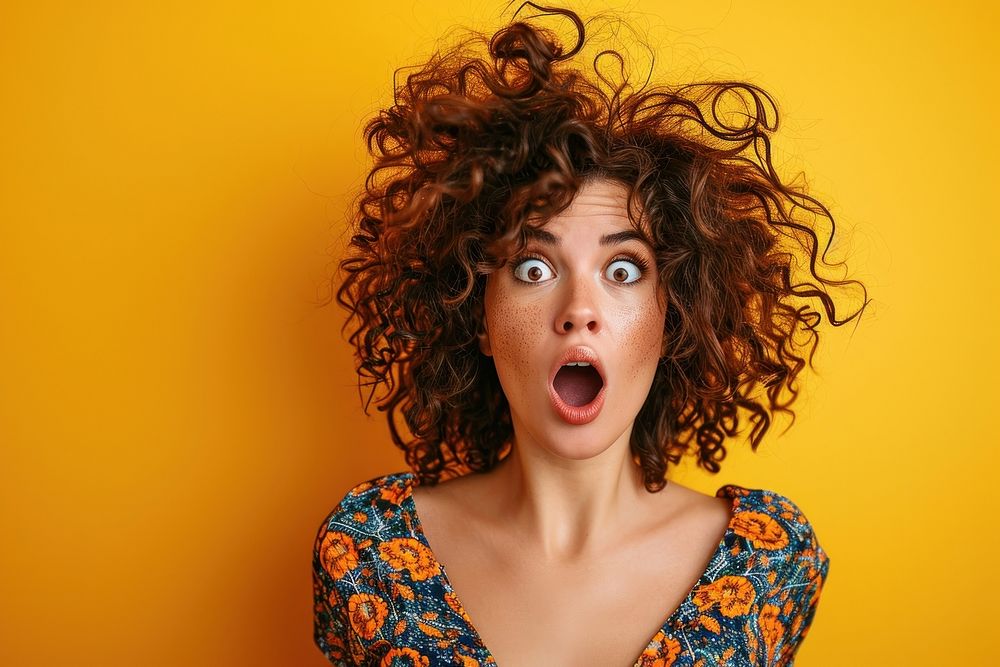 Surprised Woman with Big Hair surprised yellow adult. AI generated Image by rawpixel.