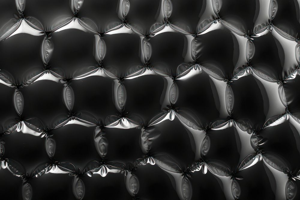 Sheeting of various sizes bubble wrap black backgrounds abstract.