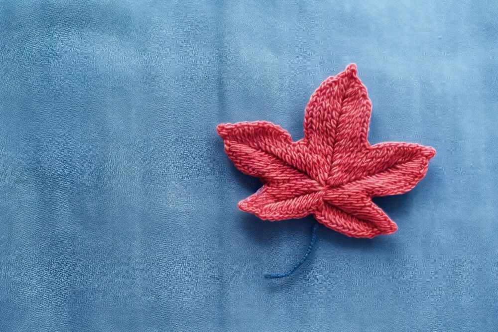 A knit flower on denim pattern plant leaf. AI generated Image by rawpixel.