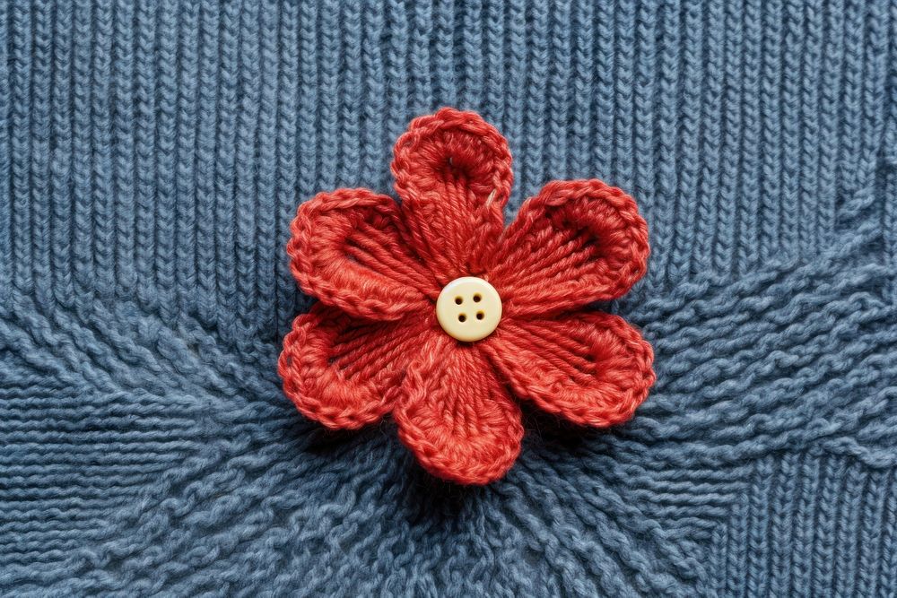 A knit flower on denim pattern accessories creativity. AI generated Image by rawpixel.