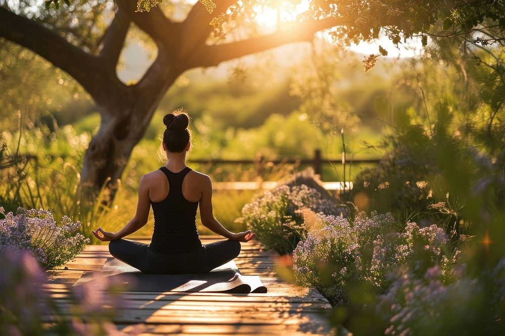 A Latino yoga instructor leading a serene outdoor summer yoga session tranquility sunlight outdoors. AI generated Image by…