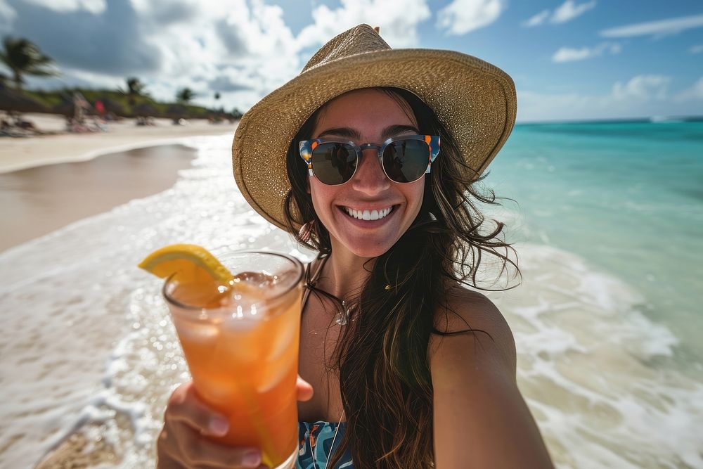 Selfie Latina woman holding a tropical drink on a beach portrait vacation summer. AI generated Image by rawpixel.