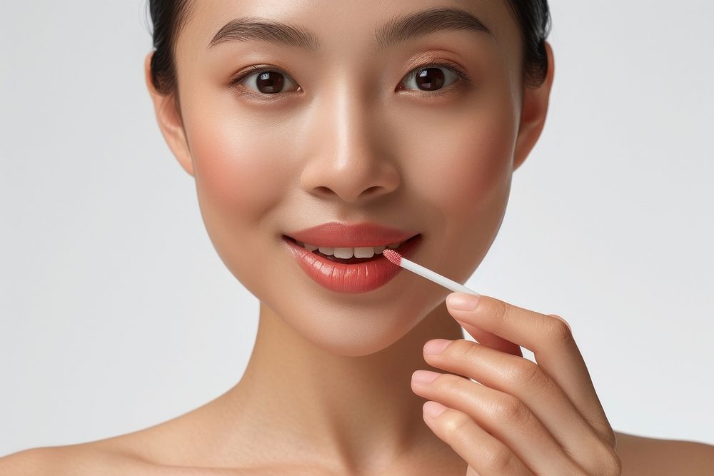 South east asian woman cosmetics portrait holding.