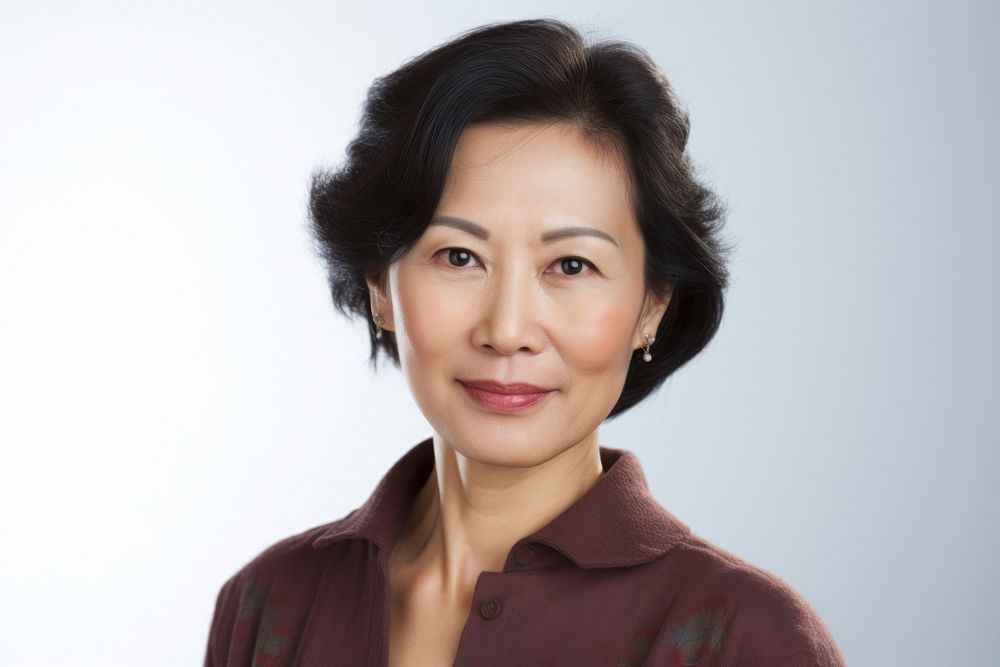 Middle aged chinese woman photo portrait adult smile. AI generated Image by rawpixel.