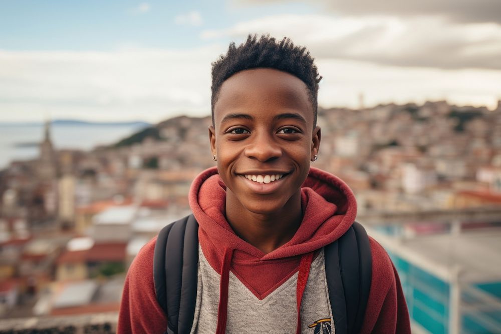 African boy wearing casual attire standing portrait smiling.