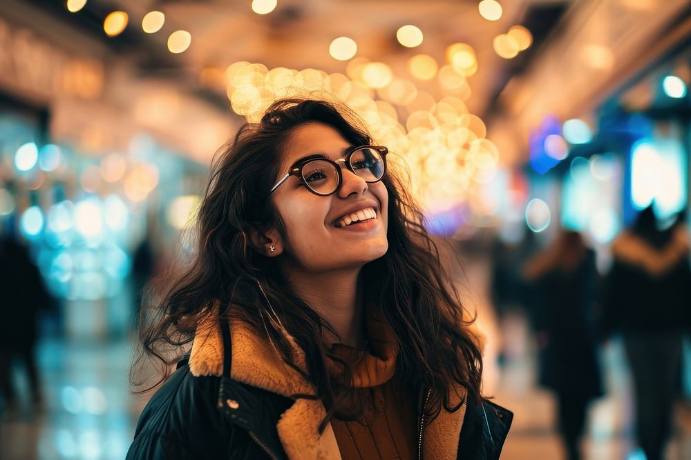 Happy latina in shopping mall laughing portrait glasses. AI generated Image by rawpixel.