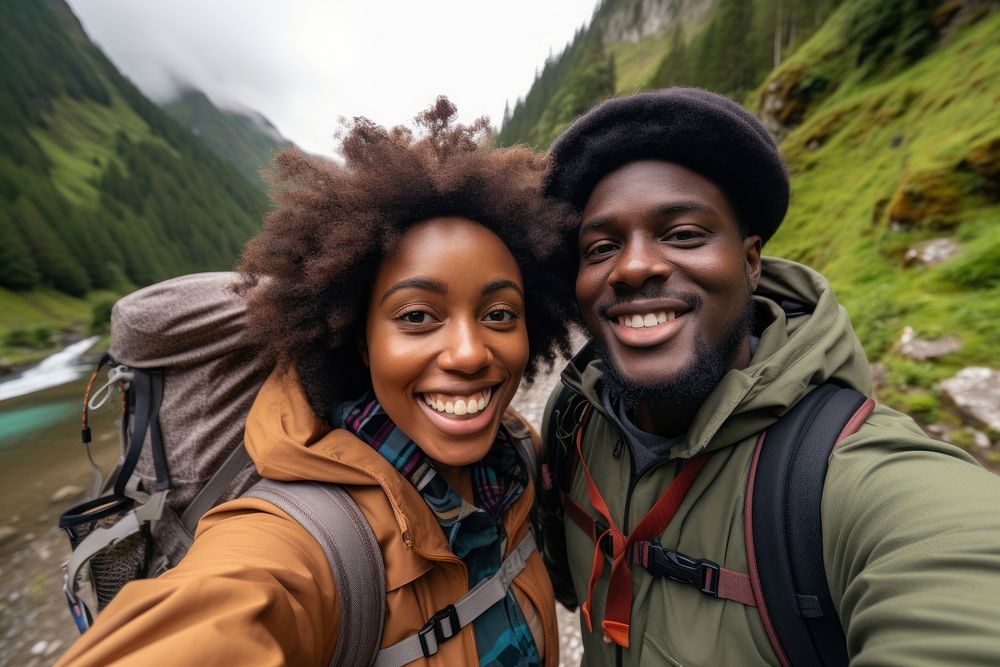 African couple traveler taking a selfie hiking backpacking adventure.