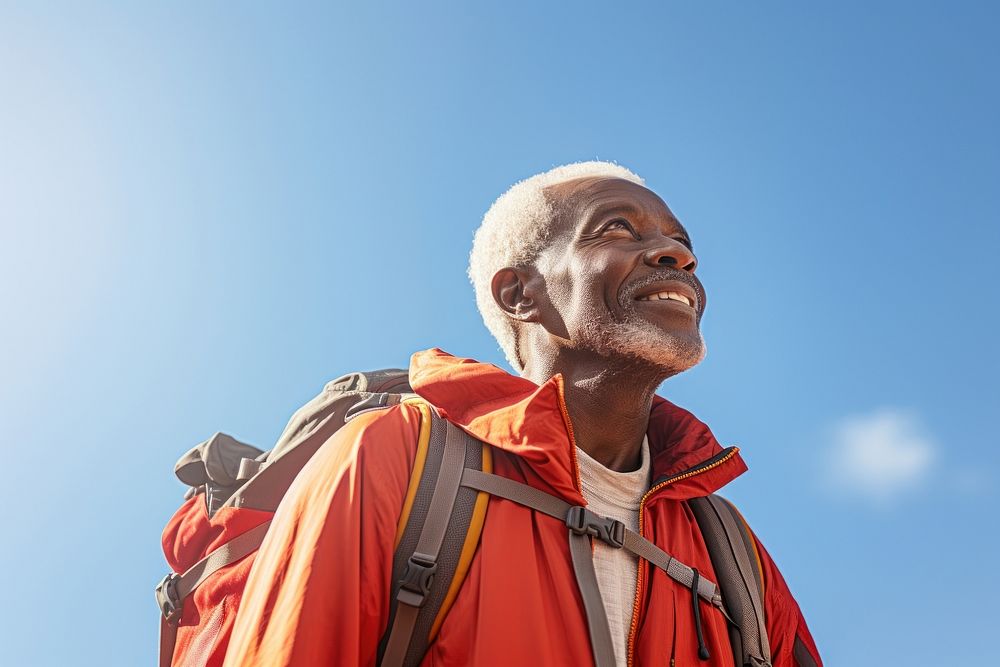 African senior man hiking adult blue sky.