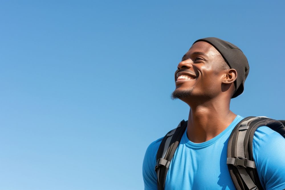 African young man hiking backpack looking smile.