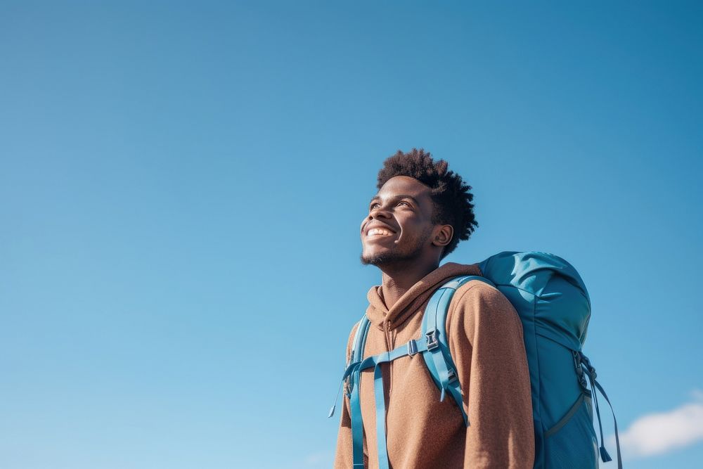 African young man hiking backpack looking adult.