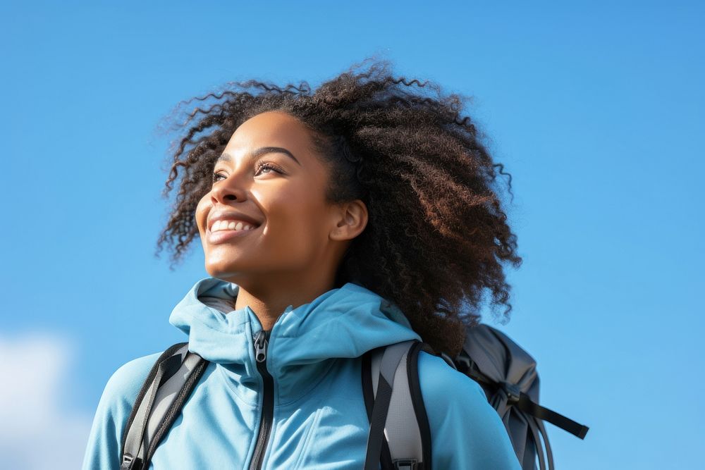 African young woman hiking backpack looking jacket.