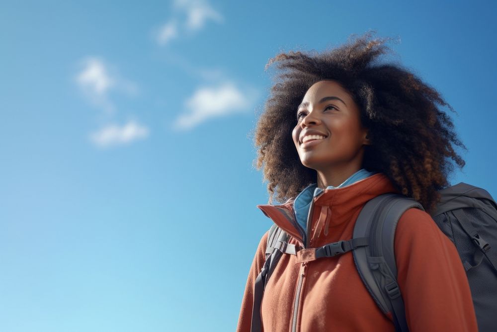 African young woman hiking backpack looking smile.