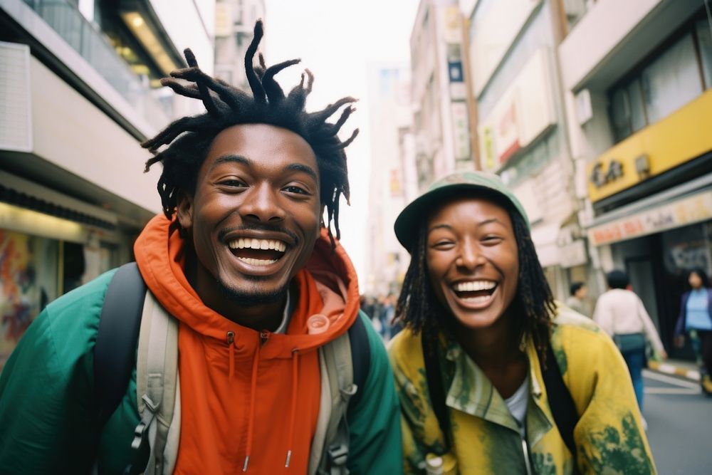 Two African people Backpackers in tokyo laughing outdoors adult.