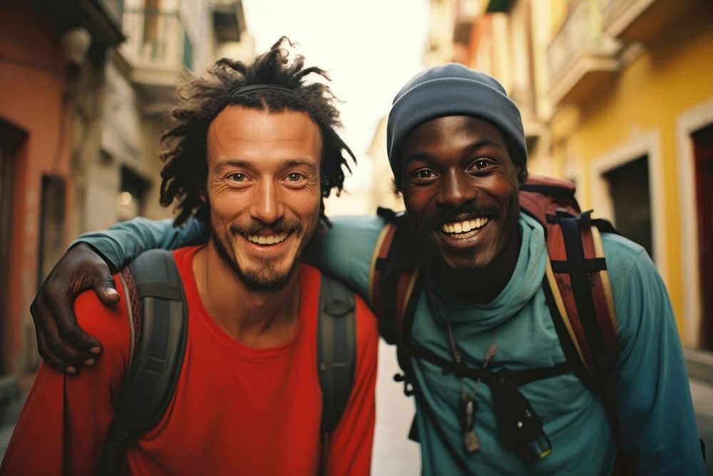 African Backpackers in italy laughing portrait outdoors.