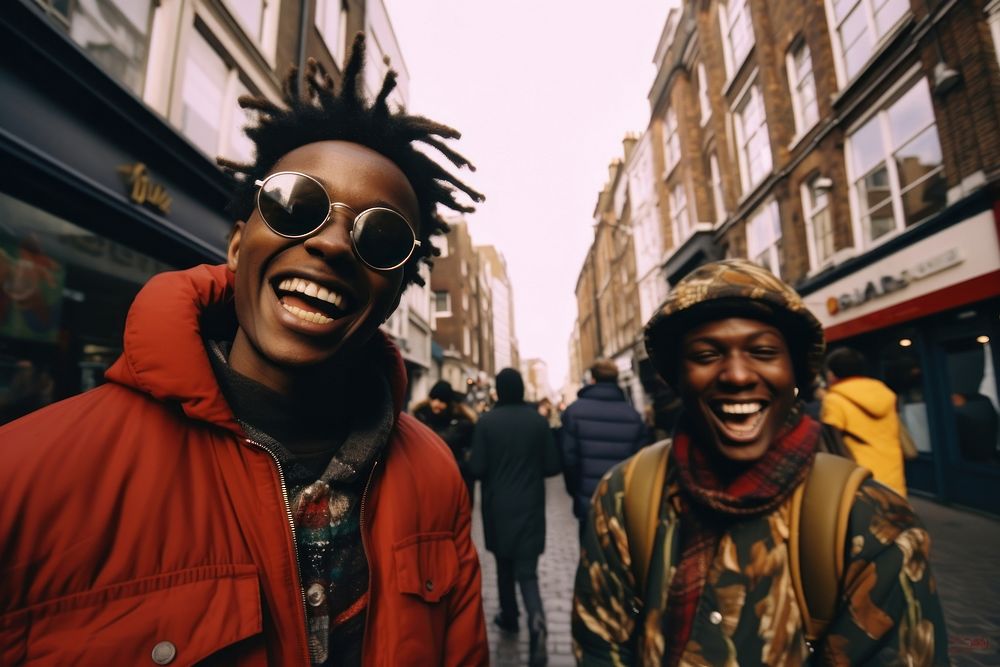 African Backpackers in london outdoors portrait laughing.
