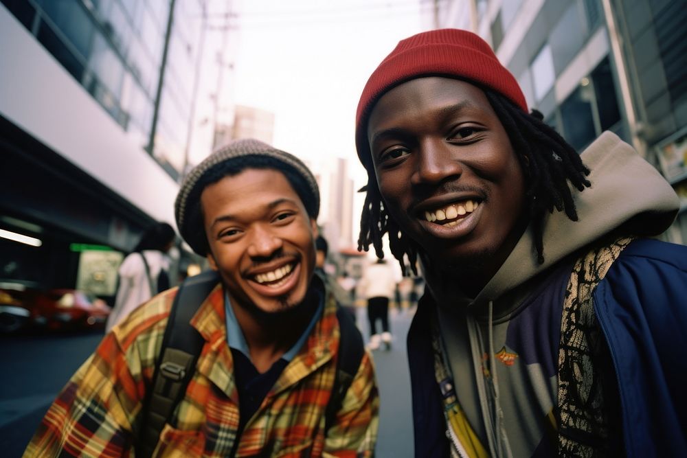 African Backpackers in tokyo portrait laughing outdoors.