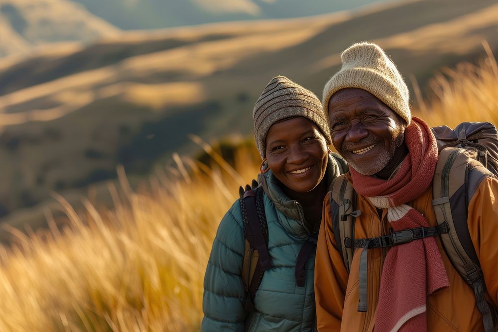 African senior couple hiking adventure mountain outdoors.