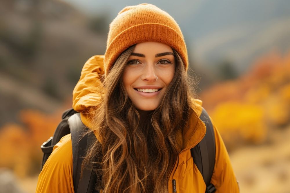 Woman hiking mountain portrait smiling.
