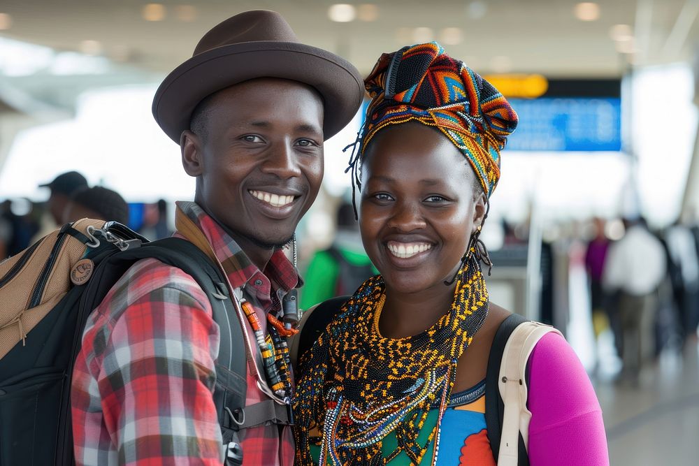 Kenyan couple backpacker at the airport portrait adult smile.