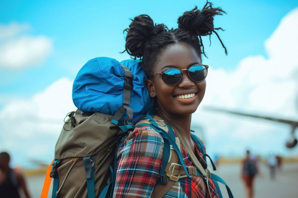 Nigerian girl backpacker at the airport sunglasses portrait smile.